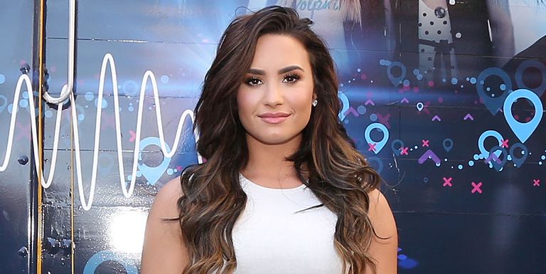 demi-lovato-hands-out-sweet-treats-and-tickets-to-her-sold-news-photo-607412024-1532521276